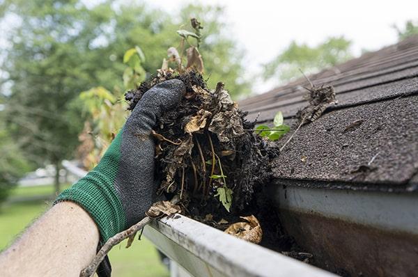 we use a combination of hand removal and pressure washing for thorough gutter cleaning